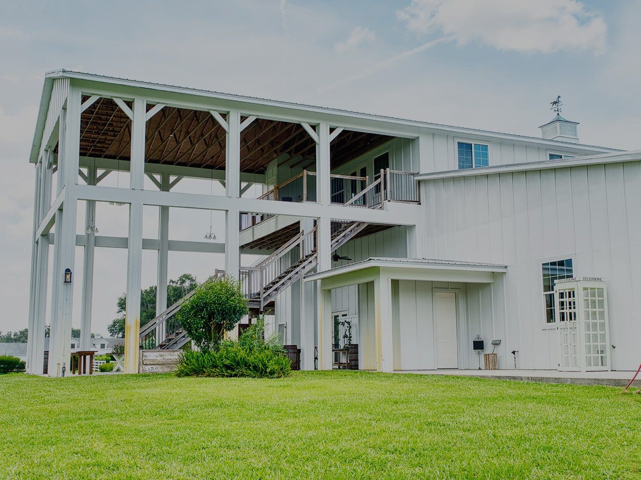 Exterior view of the Upper Barn at Covington Farm showcasing rustic architecture and event-ready spaces.